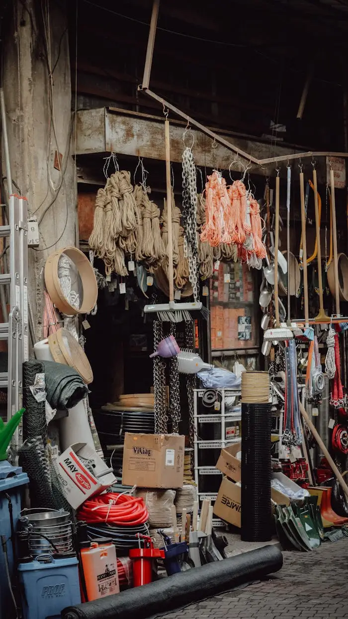 about-us-01 Rustic workshop filled with various tools, materials, and industrial supplies.